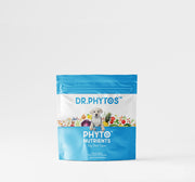 A stand-up pouch of Dr. Phytos Phytonutrients dog food topper, featuring a bright blue and white design with a small dog illustration and colorful fruits and vegetables.